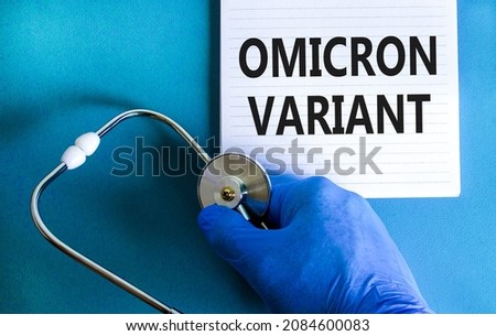 New covid-19 omicron variant strain symbol. Hand in blue glove with white note. Concept words Omicron variant. Stethoscope. Medical and COVID-19 omicron variant strain concept. Copy space.