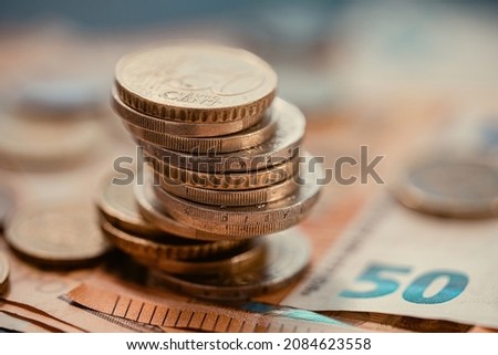 Pile of euro coins on euro notes. Royalty-Free Stock Photo #2084623558