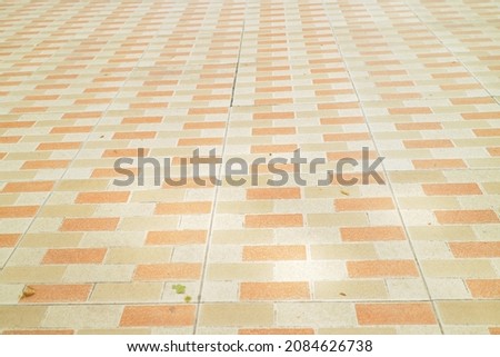 ceramic floor with brown and orange motifs photo