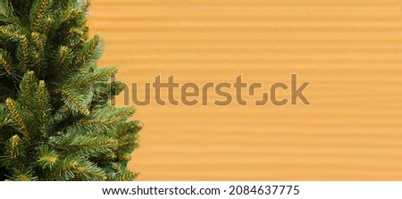 The Cristmas tree is not decorated with a close-up on a wooden background. Chrismas tree. Branches of an evergreen tree Royalty-Free Stock Photo #2084637775