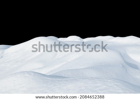 Snow drifts on a black isolated background. Snowy landscape of the hills of the North. Winter season. Royalty-Free Stock Photo #2084652388