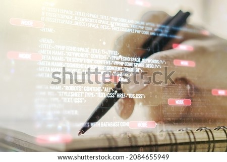 Double exposure of abstract programming language with man hand writing in notebook on background, research and development concept