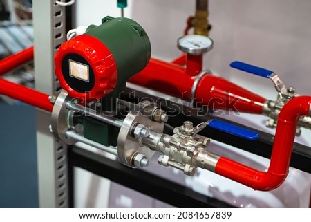 Gas pumping equipment. Red gas pipes with metering sensors. Gas consumption accounting concept. Gasification equipment and pipes. Heating house with methane. Gasification of enterprise.