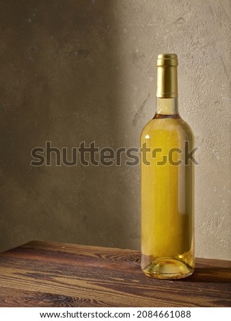 whine bottle on wooden kitchen table Royalty-Free Stock Photo #2084661088