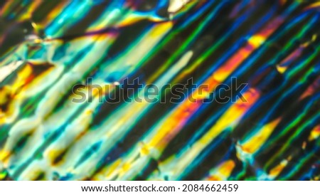 Out of focus photo lens overlays heavy grain noise abstract hologram vivid colorful texture background.
Gradient spectrum rainbow prism iridescent pattern.