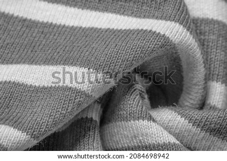 fabric from gray and white woolen stripes, woolen knitwear, which is elegant and pleasant to work with. Great for your projects. Texture, design