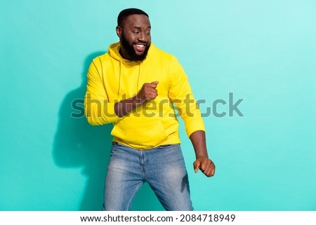 Photo of energetic positive guy dance hip hop floor look empty space isolated over cyan color background
