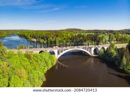 Summer aerial view of bridge and Kymijoki river waters in Finland, Kymenlaakso, Kouvola, Koria Royalty-Free Stock Photo #2084720413