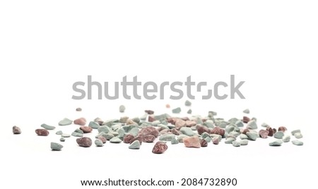 Colorful rocks, pebbles, stones pile isolated on white background, side view Royalty-Free Stock Photo #2084732890
