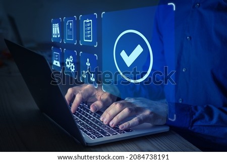 Quality management with QA (assurance), QC (control) and improvement. Standardization and certification concept. Compliance to regulations and standards. Manager or auditor working on computer. Royalty-Free Stock Photo #2084738191