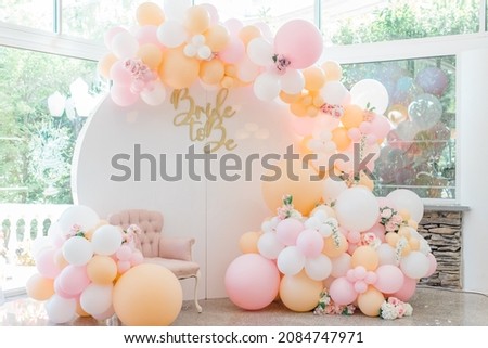 huge balloon installation for bridal shower bride to be backdrop for photos pink and orange Royalty-Free Stock Photo #2084747971