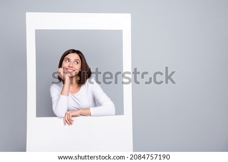 Photo of thoughtful cute lady dressed white clothes arm cheekbone standing window looking empty space isolated grey color background