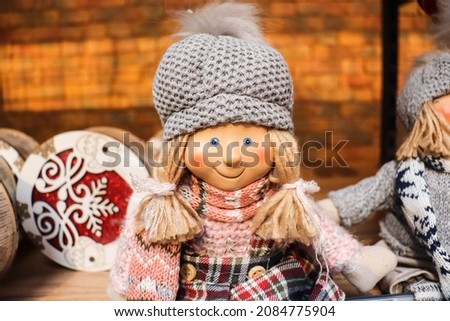 children's toys fair. cute christmas doll in beautiful clothes
