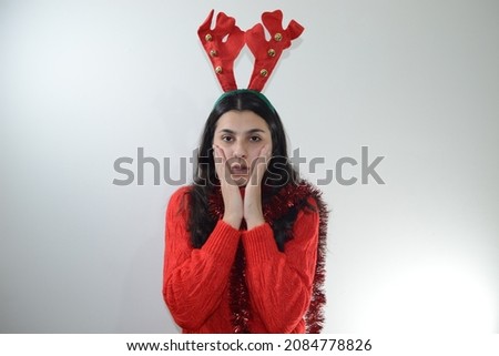 young girl poses in studio for christmas