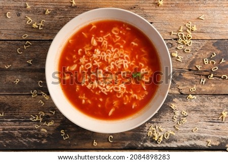 bowl of soup and alphabet noodles Royalty-Free Stock Photo #2084898283