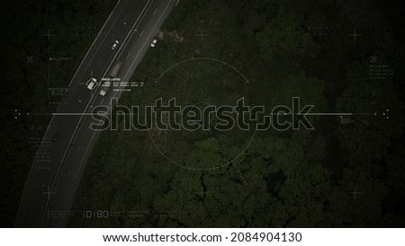 Aerial view of unmanned Aerial Vehicle UAV or reconnaissance drone monitoring highway traffic tracking and targeting suspect moving vehicle Royalty-Free Stock Photo #2084904130