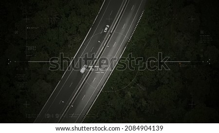Aerial view of unmanned Aerial Vehicle UAV or reconnaissance drone monitoring highway traffic tracking and targeting suspect moving vehicle Royalty-Free Stock Photo #2084904139