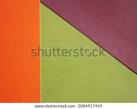 Orange green burgundy geometric surface as background. High quality photo
