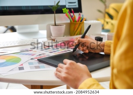 Graphic designer working in office, closeup