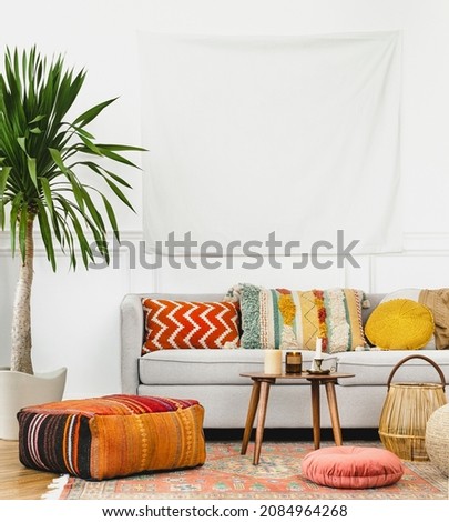 Tapestry wall in a bohemian living room Royalty-Free Stock Photo #2084964268