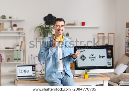 Graphic designer working in office Royalty-Free Stock Photo #2084970985
