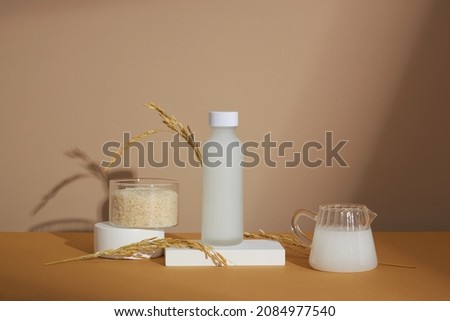 traditional food wheat and rice extract jar with white podium in light purple background for product advertising , traditional food content , front view
