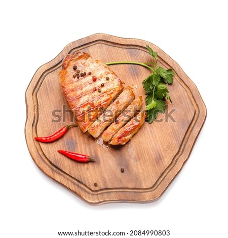 Board with tasty steak and spices on white background