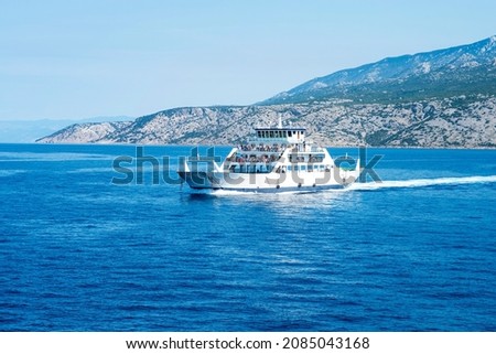 Car ferry boat in Croatia linking the island Rab to mainland passing by on adriatic sea. Royalty-Free Stock Photo #2085043168