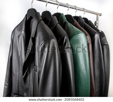New collection of different color spring leather jackets. Leather jackets on hangers in the shop. Colorful background of modern spring, autumn outerwear. Seasonal clothing in store on sale. Royalty-Free Stock Photo #2085068602