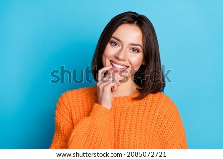 Portrait of attractive cheerful funny curious girl touching lip deciding isolated over vivid blue color background Royalty-Free Stock Photo #2085072721