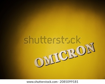 Omicron word on yellow background 
