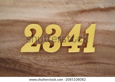 Golden Arabic numerals 2341 on a dark brown to white wood grain background.