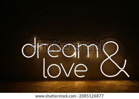 White neon sign with the inscription dream love. Trendy style. Wedding design. Neon sign. Custom neon. Home decor. 