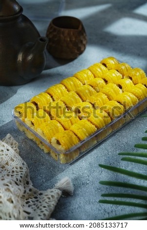 Homemade of pineapple tart over grey background. 
