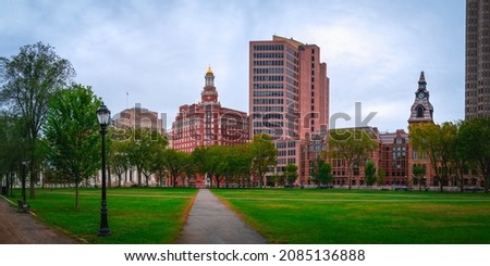 Panorama of the architectural landscape over the New Haven Green. The New Haven Green is a 16-acre recreation area in downtown New Haven, Connecticut. A great place to take a walk and relax. Royalty-Free Stock Photo #2085136888