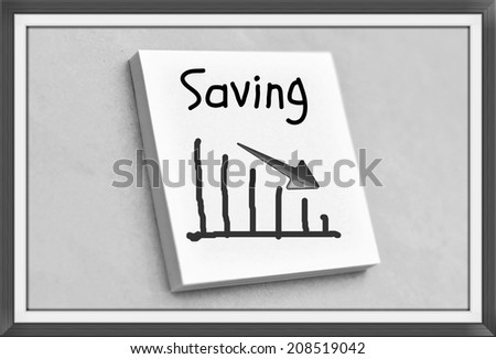 Vintage style text saving goes down on the graph on the short note texture background