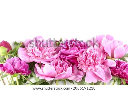 Bouquet of pink peonies on a white table. Valentine's Day gift.