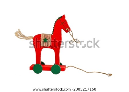 christmas toy wooden red horse isolated on white background