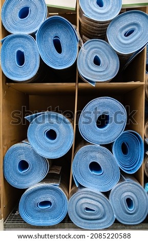 a roll of special insulation material is folded on a rack. High quality photo