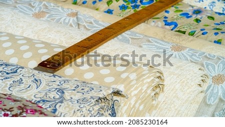 Texture, background, pattern, folk art. Fabric linen in rolls of different colors