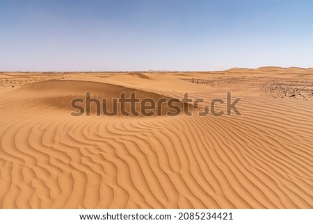 In the Sahara Desert in Morocco. The dunes of Erg Chegaga, with the furrows carved by the wind in the sand Royalty-Free Stock Photo #2085234421