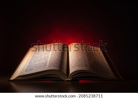 Open Bible on the table. Christian sermon. The Bible is on the Protestant's Desk. Reading The Word Of God. Study of religious literature. Prayer to God. Appeal to God.