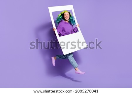 Full body photo of vivid haired lady jump hold paper border remember photography concept isolated over violet color background