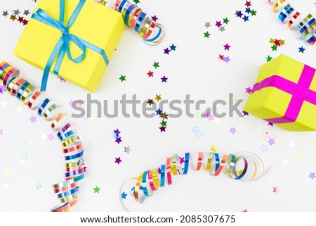 Colorful confetti and presents on white  background text place - Image 