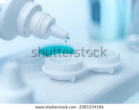 Close up of saline dropping on contact lens Royalty-Free Stock Photo #2085334186