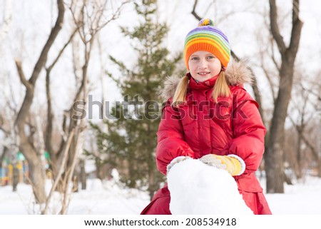 girl in a winter park, actively spending time in winter
