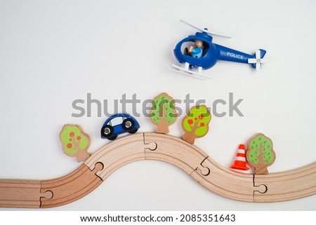 Toy wooden road on a white background. Games for the development of children.