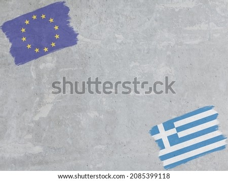 Concrete wall painted with EU and Greece flags with a dry brush