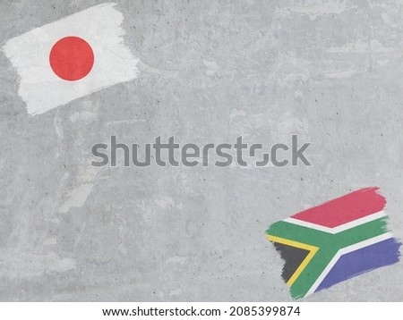 Concrete wall painted with Japan and Republic of South Africa flags with a dry brush