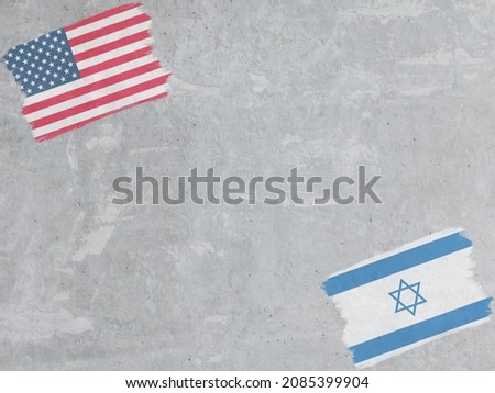 Concrete wall painted with USA and Israel flags with a dry brush